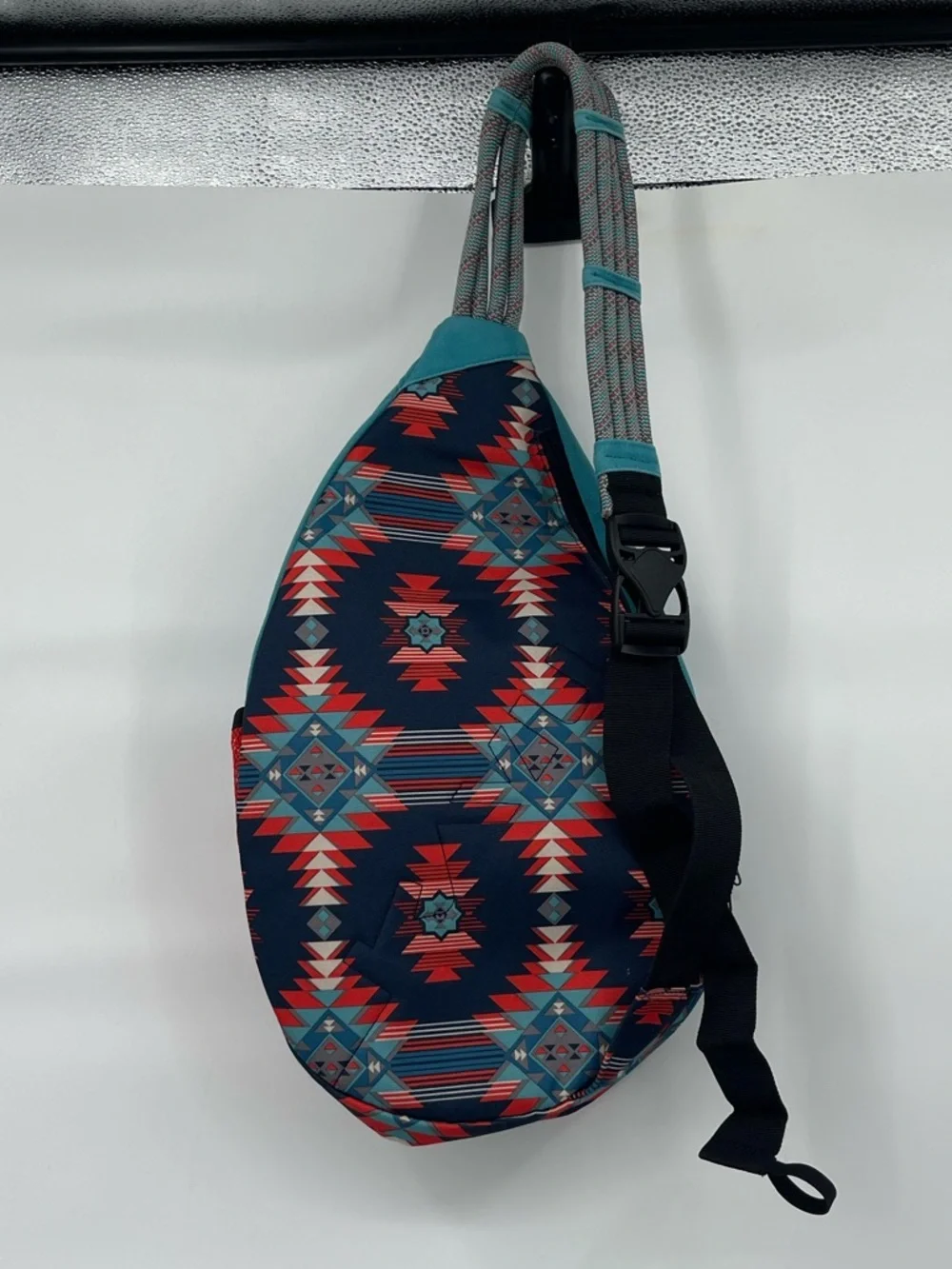 Kavu blue red aztec print sling back bag